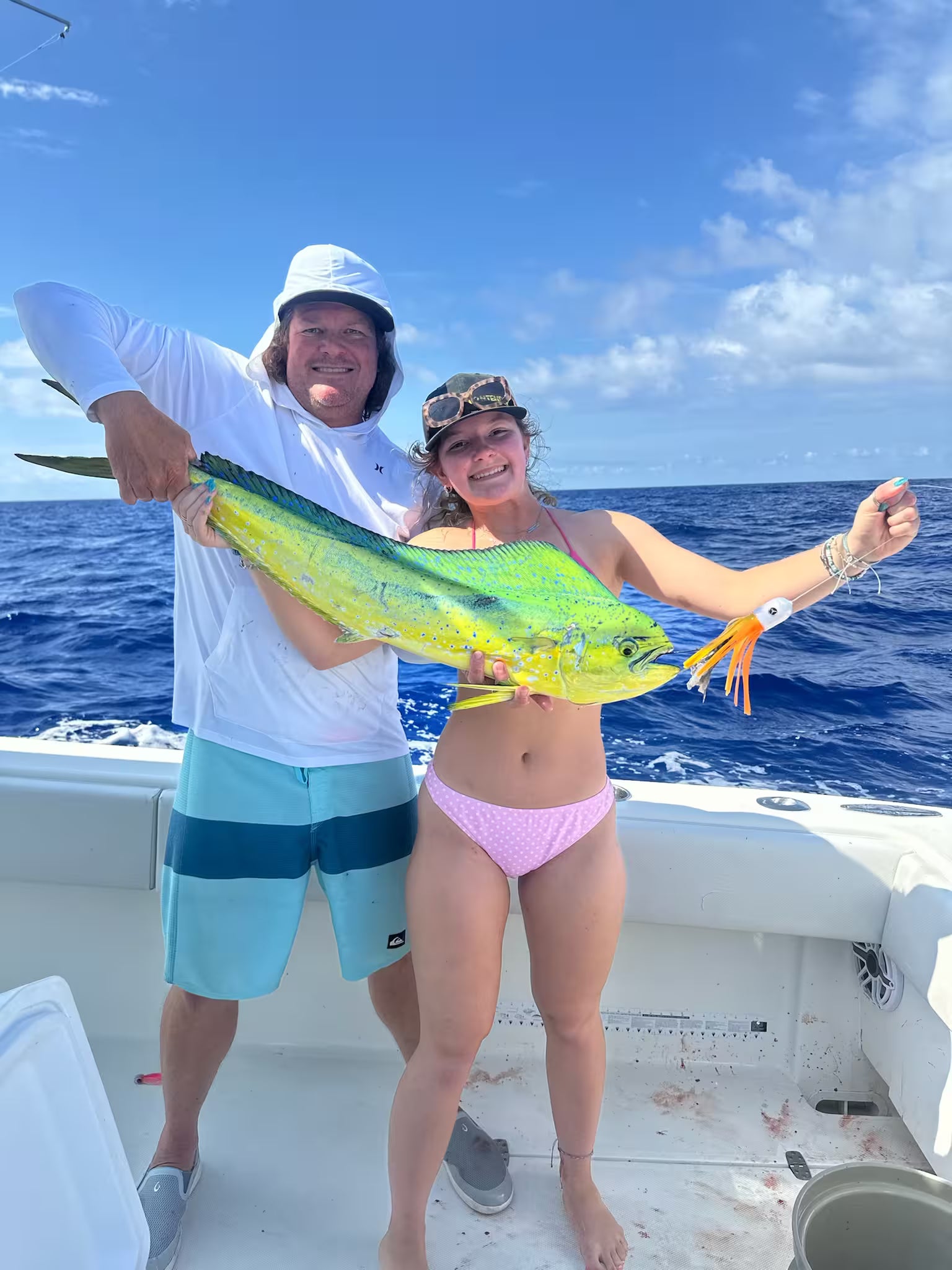 Mahi Mahi caught by man and girl on Abacoa Design orange offshore trolling lure The Fatman